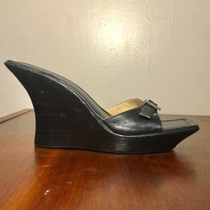 Charles Amar curves heels with rhinestone buckle